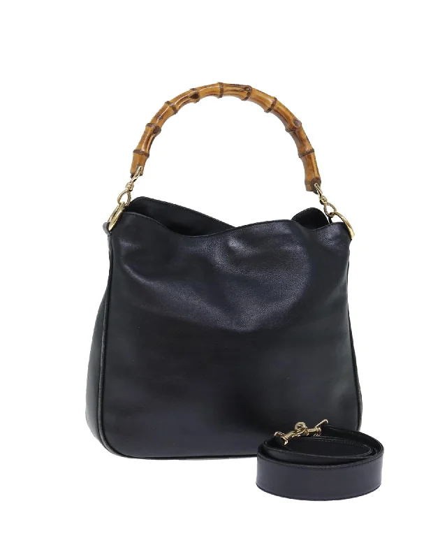 Tote bags with fold-over flaps for a functional and stylish closure-Leather Shoulder Bag with Bamboo Handle and Shoulder Strap