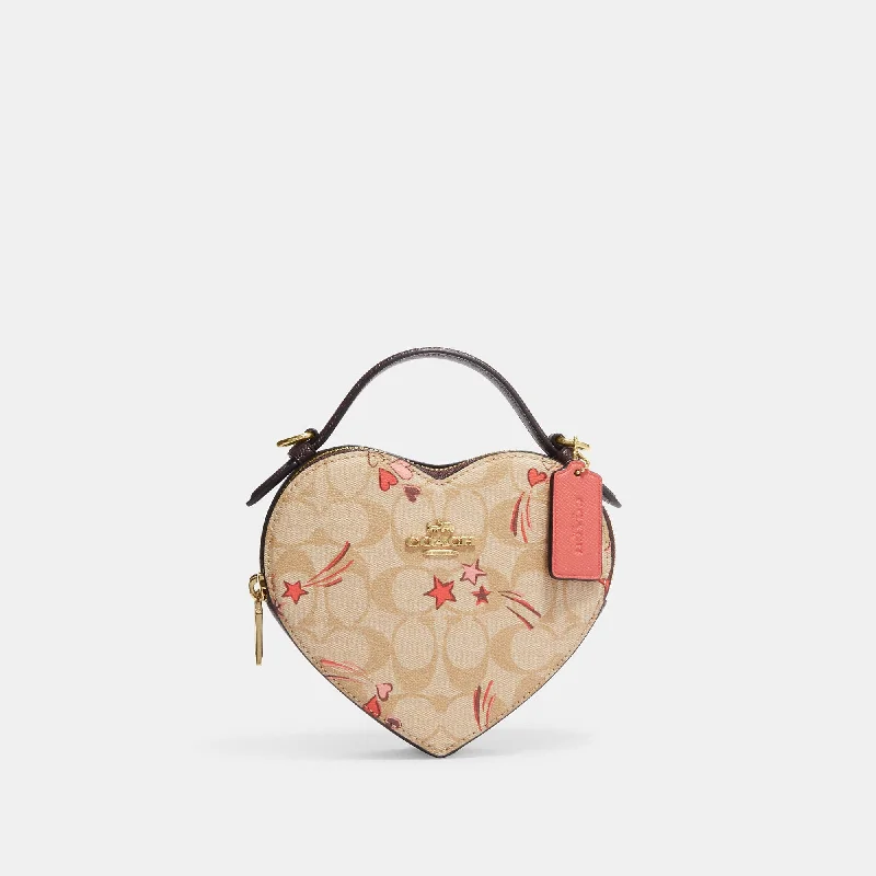 Handle bags with bohemian tassel embellishments -Coach Outlet Heart Crossbody In Signature Canvas With Heart And Star Print