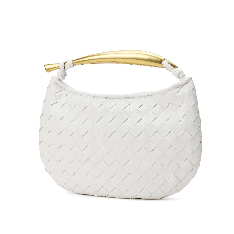 Handle bags with playful pom-poms for charm -Tiffany & Fred Woven Leather Top-Handle Bag/Clutch